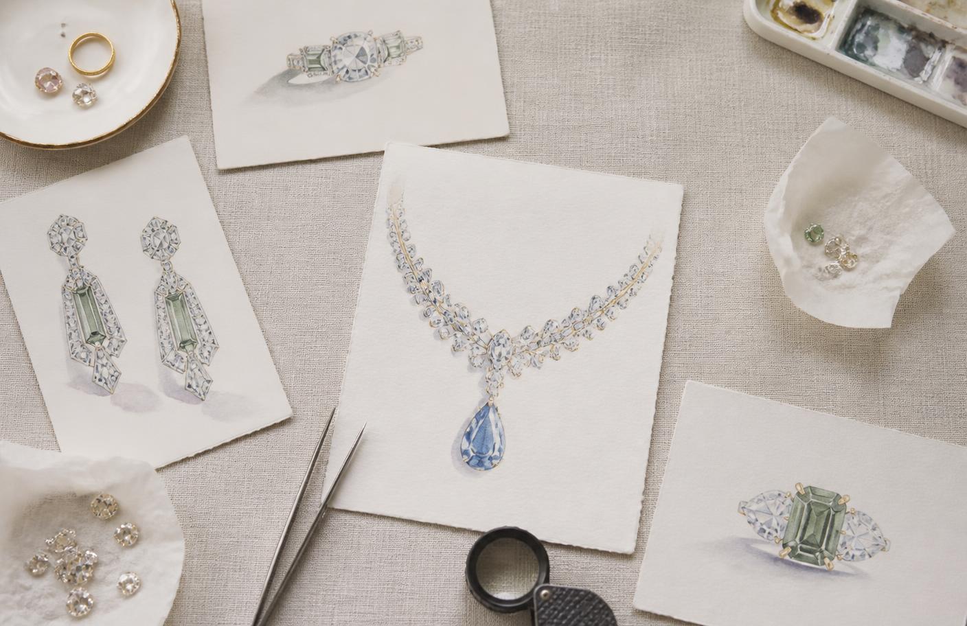 Hand-painted jewellery design sketches on an atelier desk